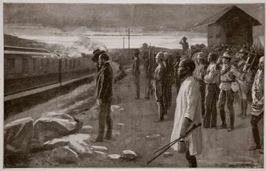 Der Zug, der die Überreste von Mr. Rhodes transportiert, wird von den Blockhauswachen auf dem Weg zu den Matopos-Hügeln begrüßt